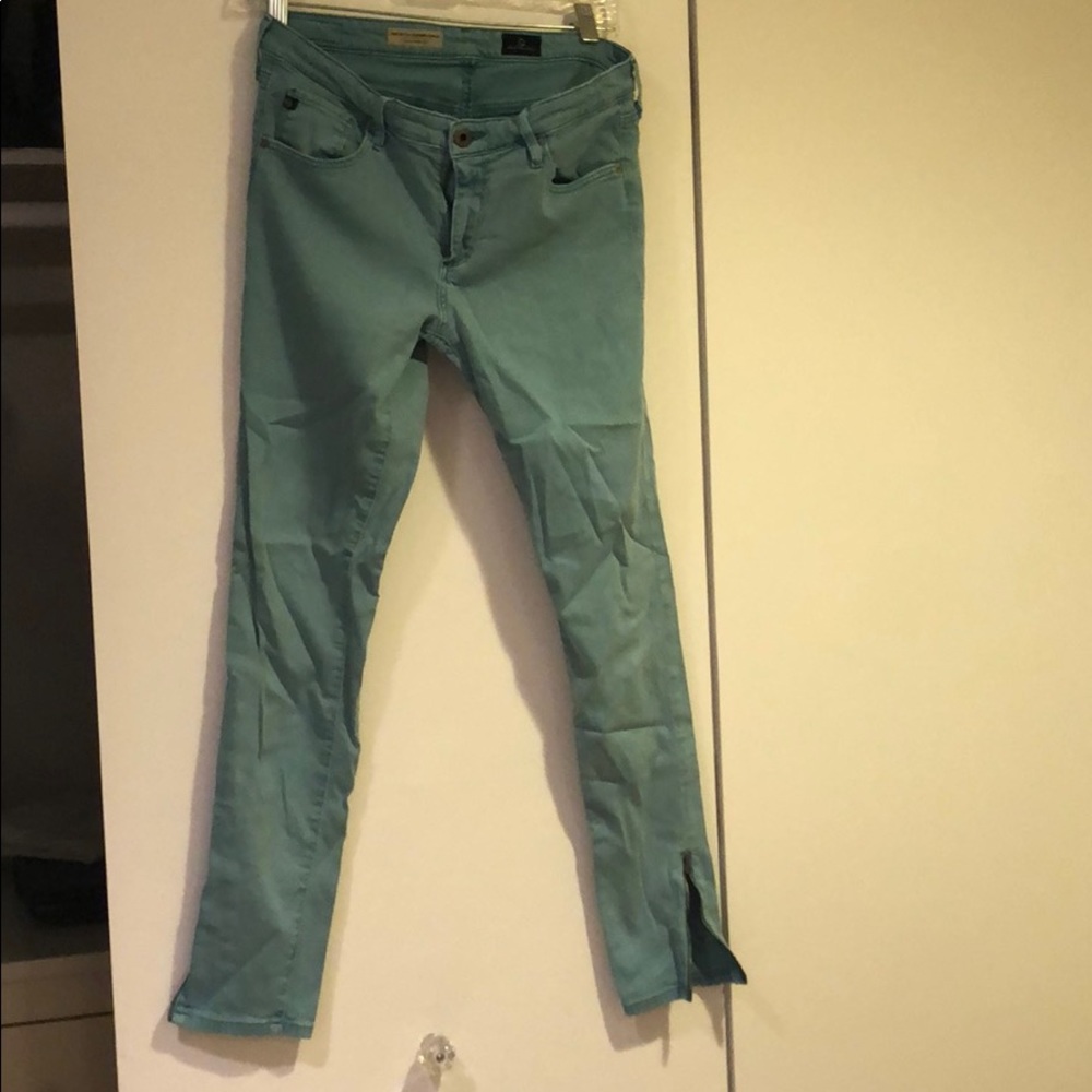 AG turquoise skinny leg zipper bottom jeans